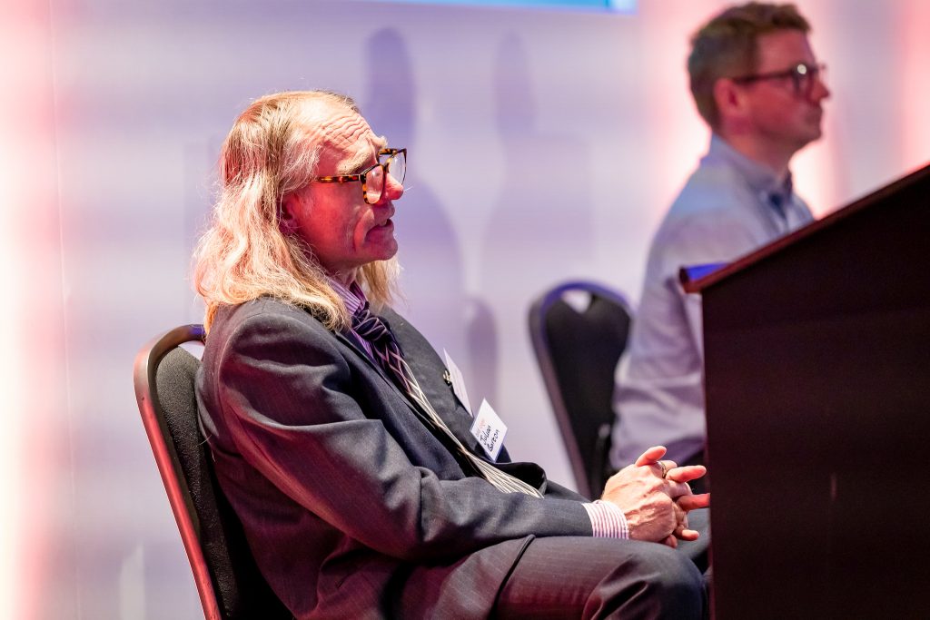 Autistic Jules and Andrew Swartfigure at the IPBS Conference 2025